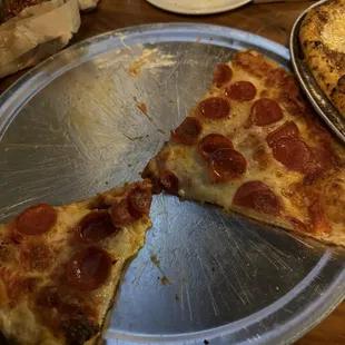 Just ok pepperoni pizza (not worth the $24 . How much we ate by the time the C Lulu arrived.