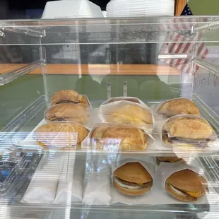 a display case filled with sandwiches