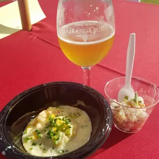 a glass of beer and a bowl of food