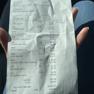 a person holding a receipt