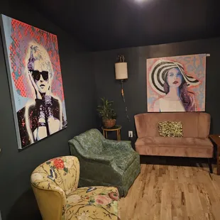 a living room with a couch and two chairs