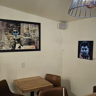 a table and chairs in a small room