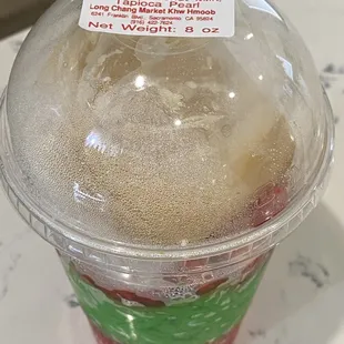 a cold drink in a plastic cup