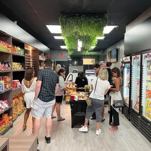 people shopping in a grocery store