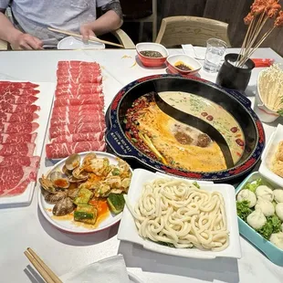 Our spread: Beef short rib, marbled beef, liver skewers, enoki mushrooms, tong ho, fried bean curd skin, fish roe balls, udon, cold dishes