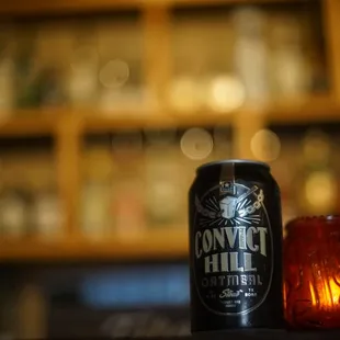 a can of beer and a candle