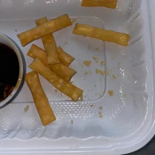 a container of fries and a cup of coffee