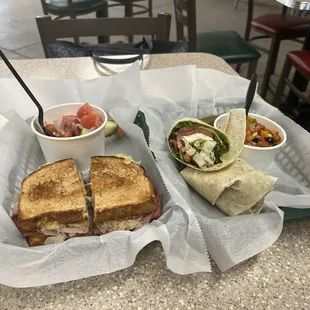 Rueben with side of cucumber, tomato and onion and Grilled Chicken Basil Pesto  wrap with Cowboy Caviar!