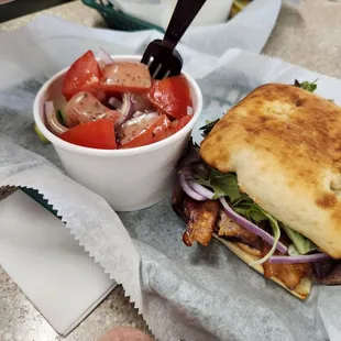 Bruce&apos;s Bombee - Roast beef with bacon, red onion, cheese and chipotle mayo. Yummo! Side of cucumber, tomato and onion salad.