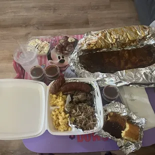 Rack of ribs, sausage, brisket, pulled pork, cole slaw, Mac and cheese, potato salad.