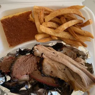 Brisket and Pulled Pork platter w/ Fries and cornbread.