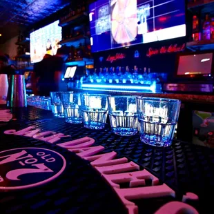 a bar with a neon sign