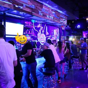 a group of people at a bar