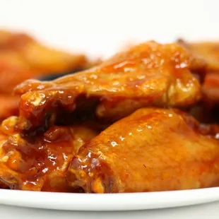 a close up of a plate of hot wings