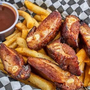 a basket of fries and dipping sauce