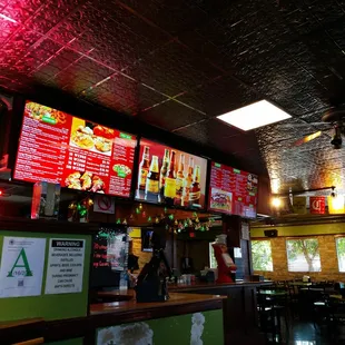 a restaurant with neon signs