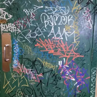 a door covered in graffiti