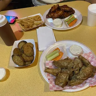 Lemon pepper wings, fired zucchini, Cajun fries, honey barbecue wings