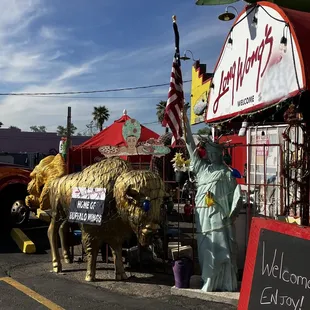 a statue of the statue of liberty and a cow