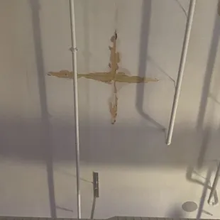 The ceiling that's leaking all over tables and the bar.