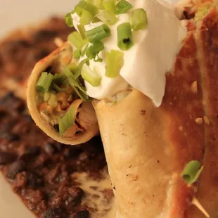 Chicken burrito served over chili