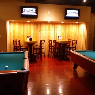 Backroom pool tables with drinks &amp; dining