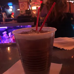 a cold beverage in a plastic cup