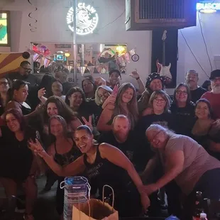 a large group of people at a bar