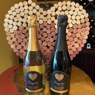 two bottles of wine on a table