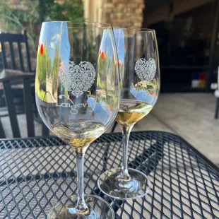 two wine glasses on a table