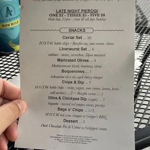 a person holding a menu at a restaurant