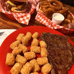 Burger, steak, tots and onion rings