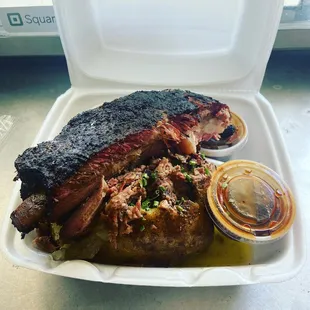 a large piece of meat in a styrofoam container