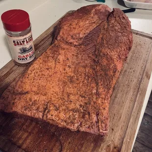 a large piece of meat on a cutting board