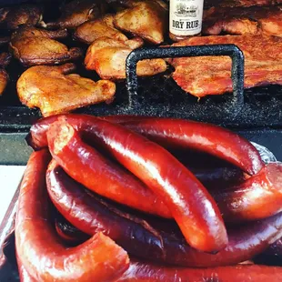 sausages and hot dogs on a grill