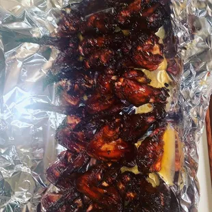 chicken wings wrapped in tin foil