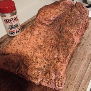 a large piece of meat on a cutting board