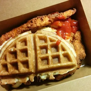 Spicy chicken tenders, fries, and waffles