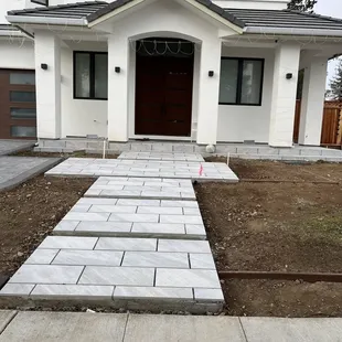 a walkway leading to a house