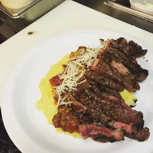 Grilled balsamic ribeye on polenta with mushroom ragout