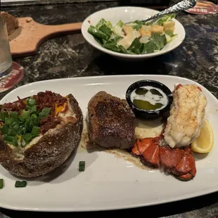 Renegade Sirloin and 4oz. Lobster Tail with Loaded Baked Potato and a Caesar Salad. Delicious and cooked perfectly!