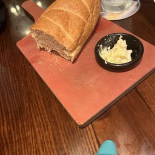 The delicious fresh baked bread and butter the waitress brought to the table