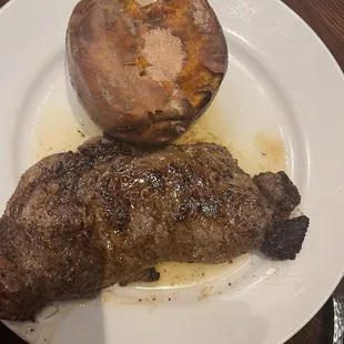 My ribeye steak and baked sweet potato with butter and brown sugar.