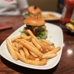 a plate of french fries and a burger