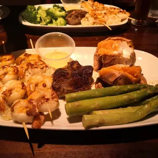 The tiny overcooked steak and raw shrimp.