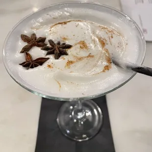 a drink in a glass with a spoon