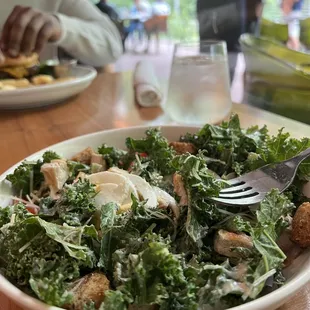 Kale caesar salad with added chicken breast.