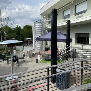 patio area with tables and umbrellas