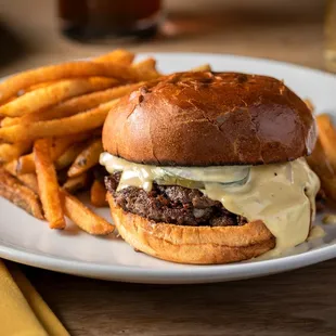 a burger and fries on a plate