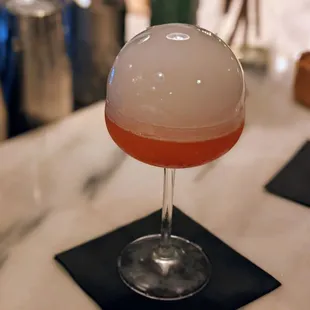 a glass with a liquid inside